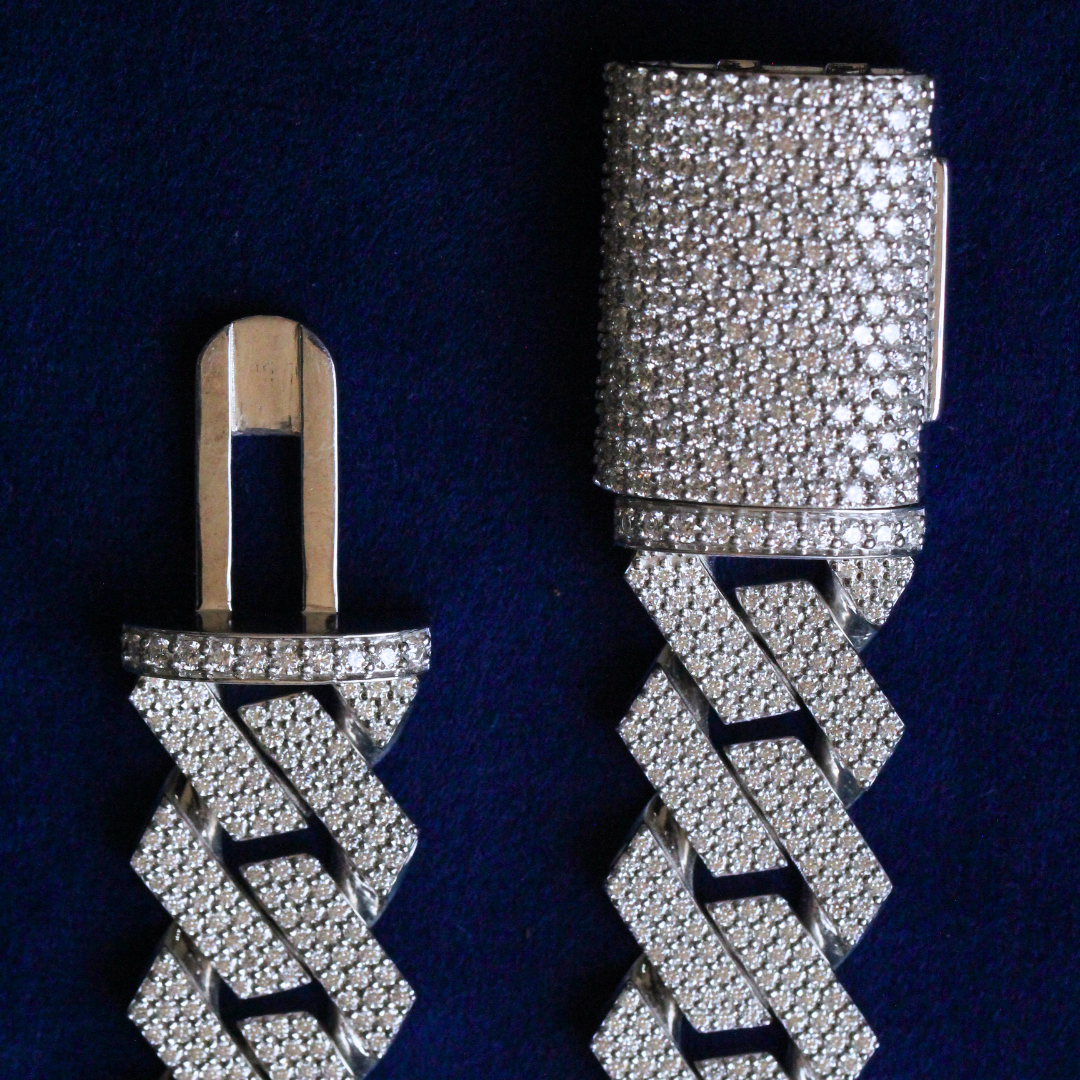 Close-up view of locked clasp on Cuban link chain made with 925 silver and moissanite diamonds, secure fine jewelry design.