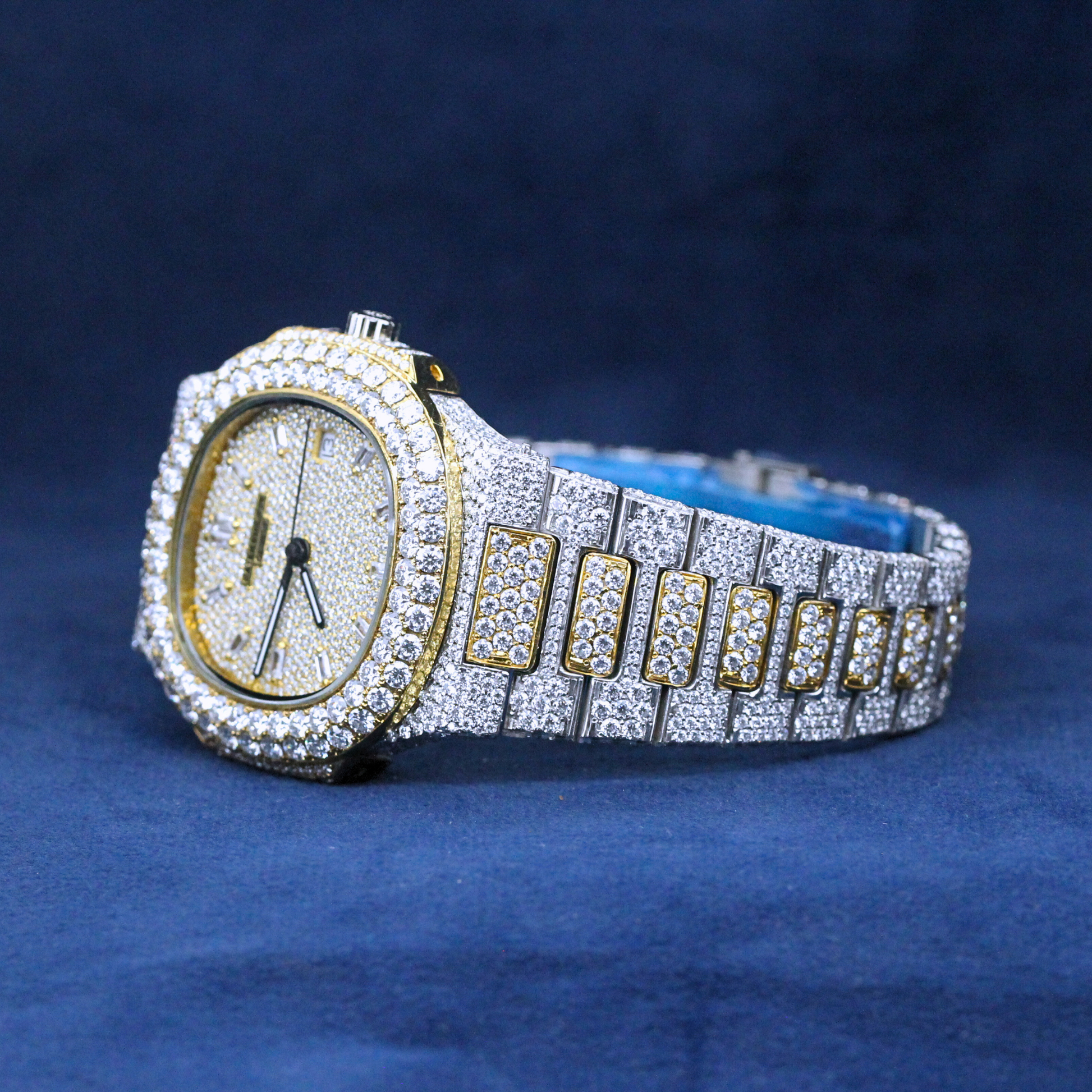 A left-side view of a custom iced-out hip-hop watch with a luxurious two-tone finish, showcasing a fully iced bracelet set with Moissanite diamonds.