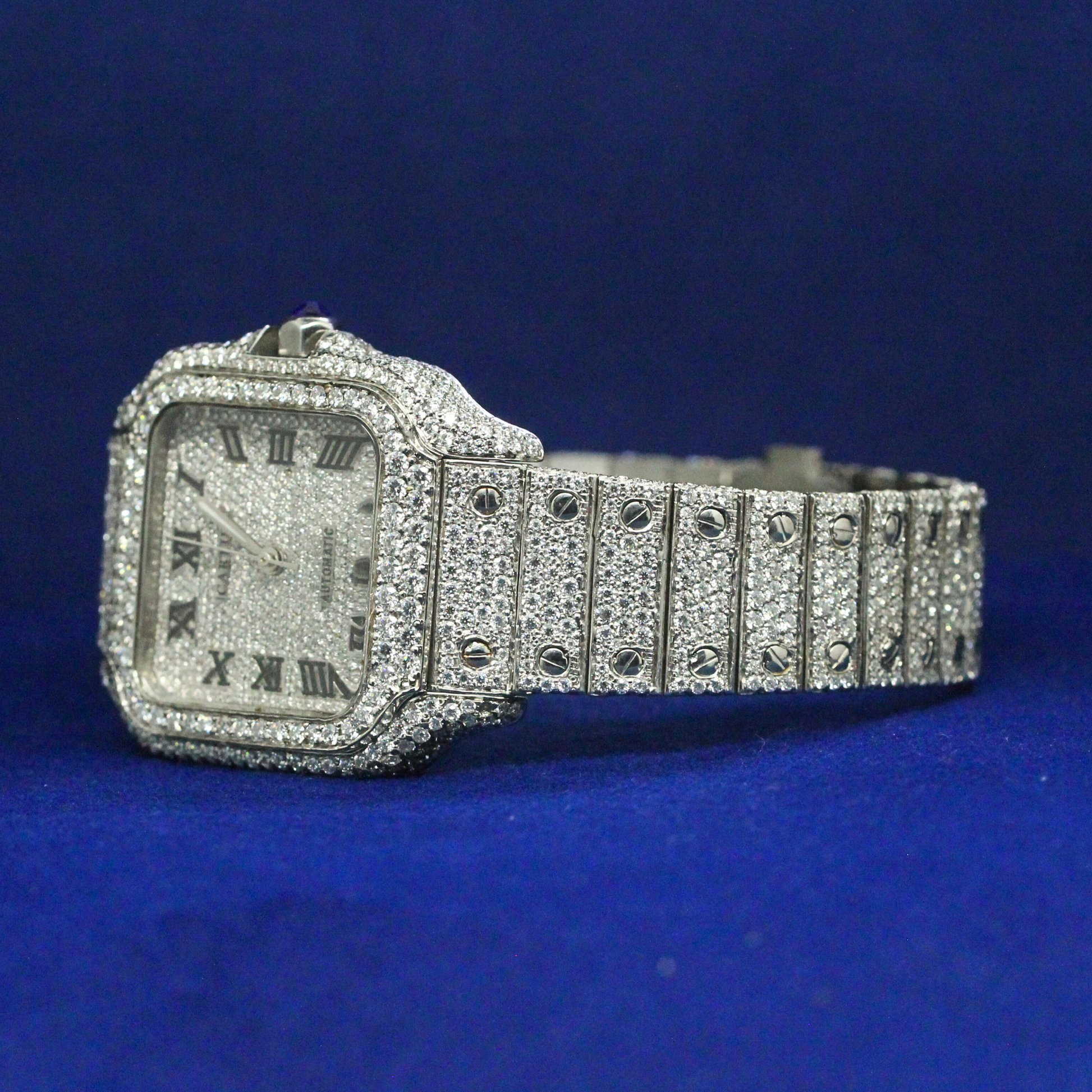 Right side view of the Diamond Roman IceQueen watch showing case depth and shimmering moissanite stones.