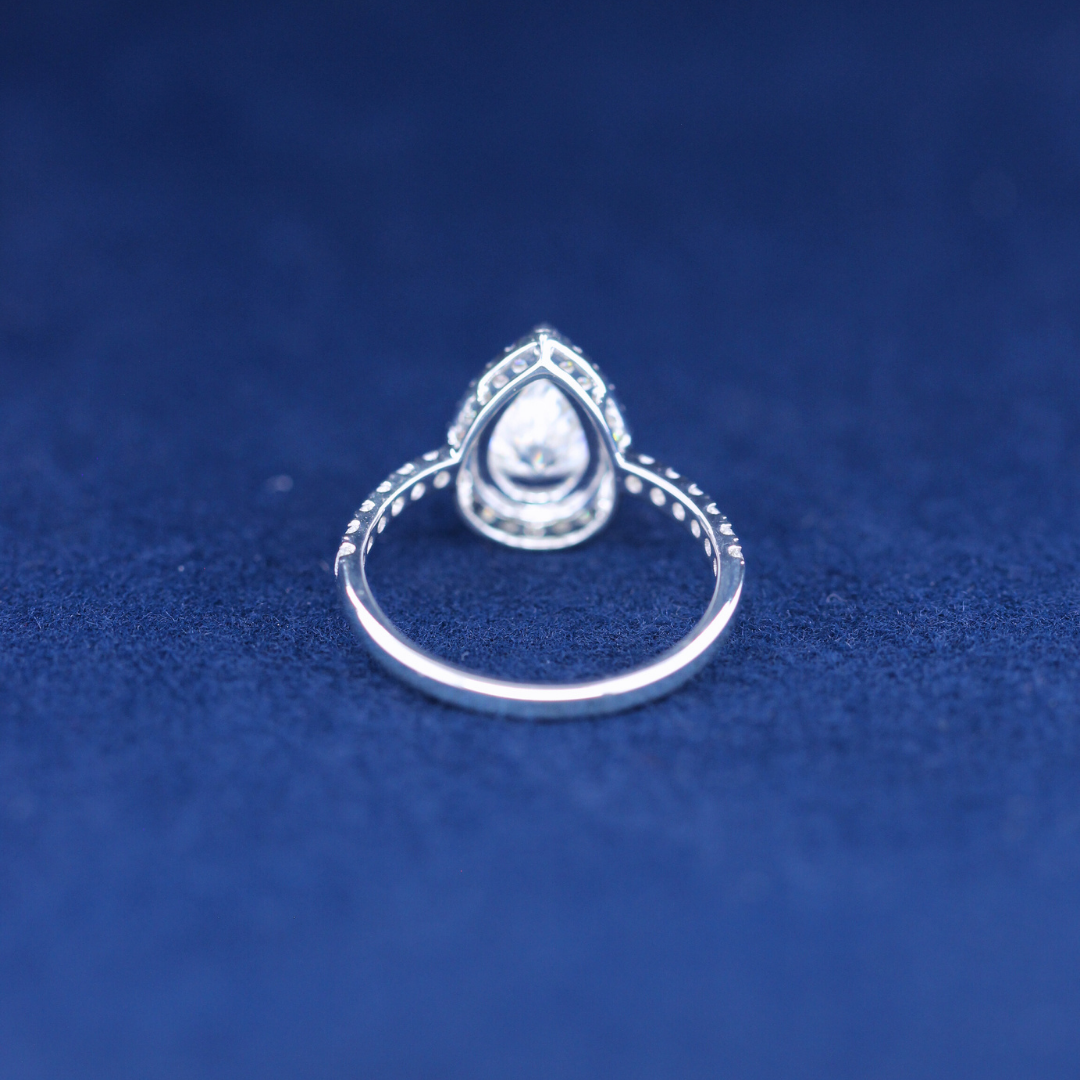 A back-side view of a fine jewelry hip-hop pear moissanite diamond ring in 925 sterling silver, displaying the polished band and detailed craftsmanship.