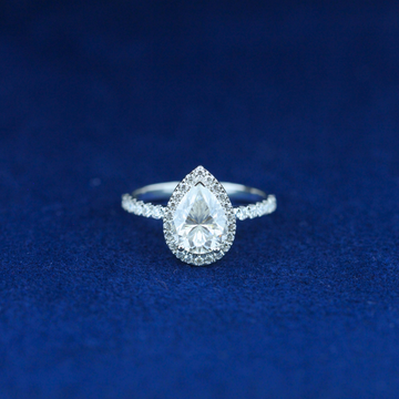 A stunning fine jewelry hip-hop pear-cut moissanite diamond ring in 925 sterling silver, featuring an elegant teardrop-shaped diamond with a bold, statement design