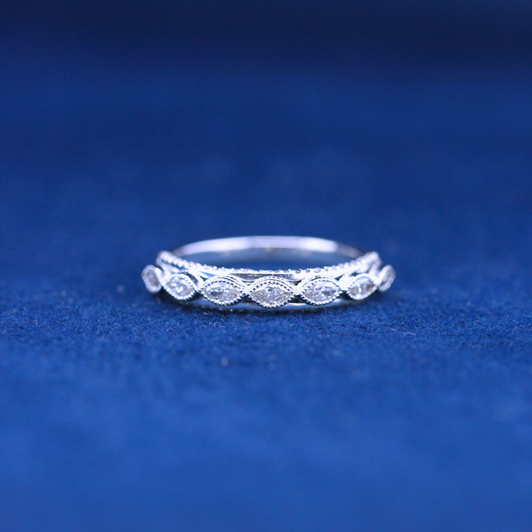 A luxurious fine jewelry ring in 925 sterling silver, featuring seven marquise-cut diamonds set in an elegant, high-end design.