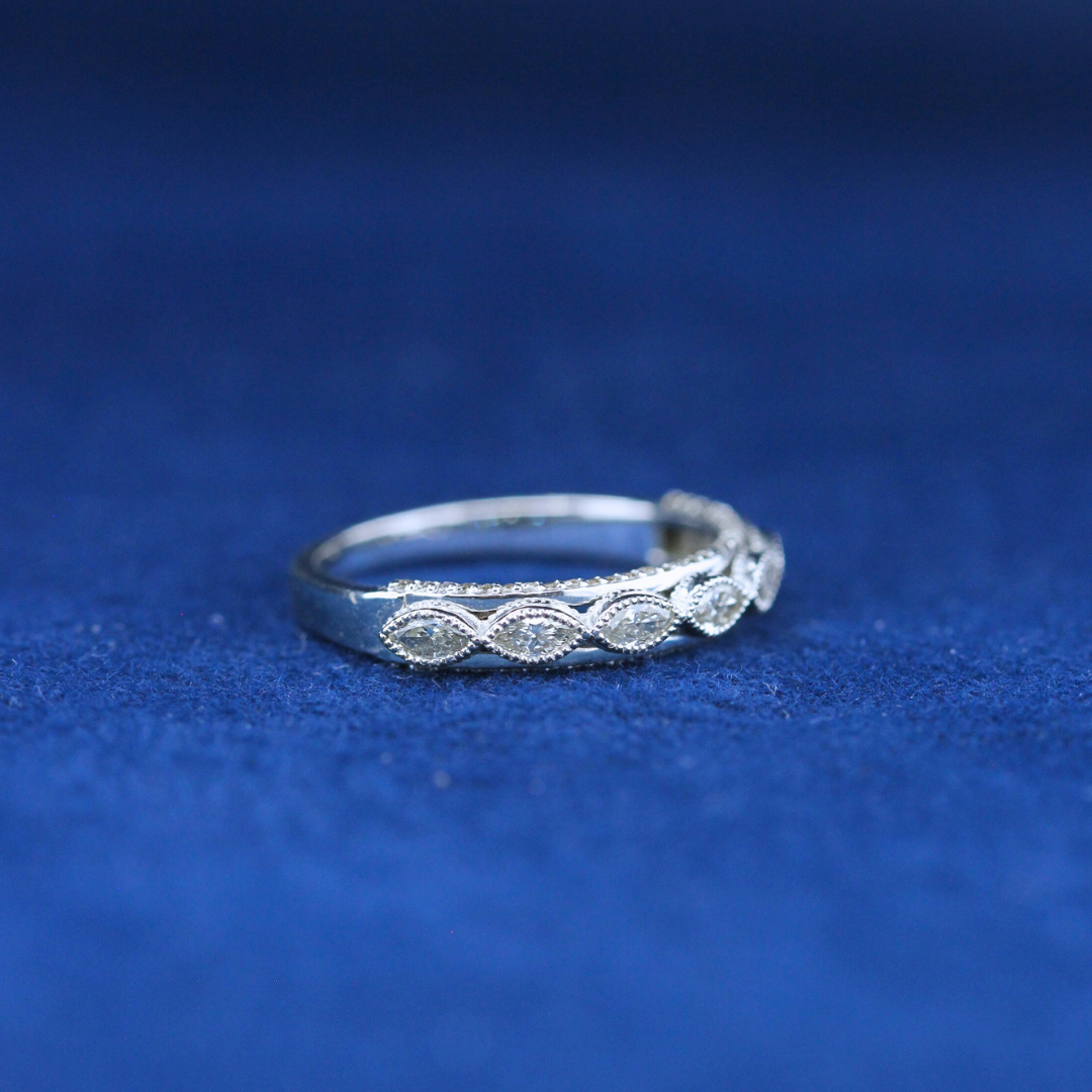 A left-side view of a fine jewelry 7 marquise diamond ring in 925 sterling silver, highlighting its elegant structure and sparkling diamonds.