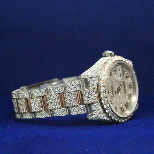 Right side profile of Golden Roman Majesty watch showing iced bezel, gold tone case, and diamond detailing.