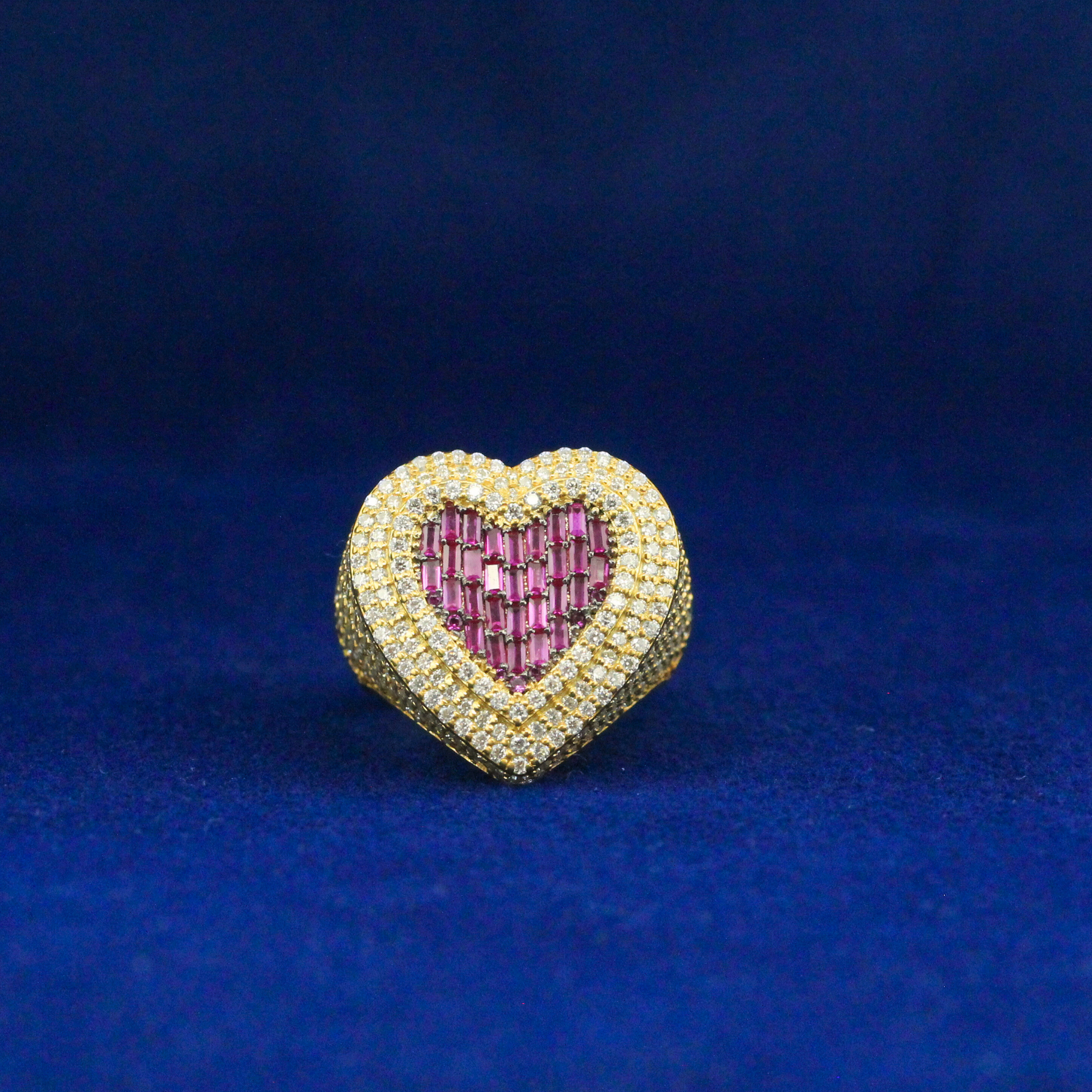 Front view of gold heart-shaped ring with moissanite diamonds, bold and stylish hip hop jewelry piece.