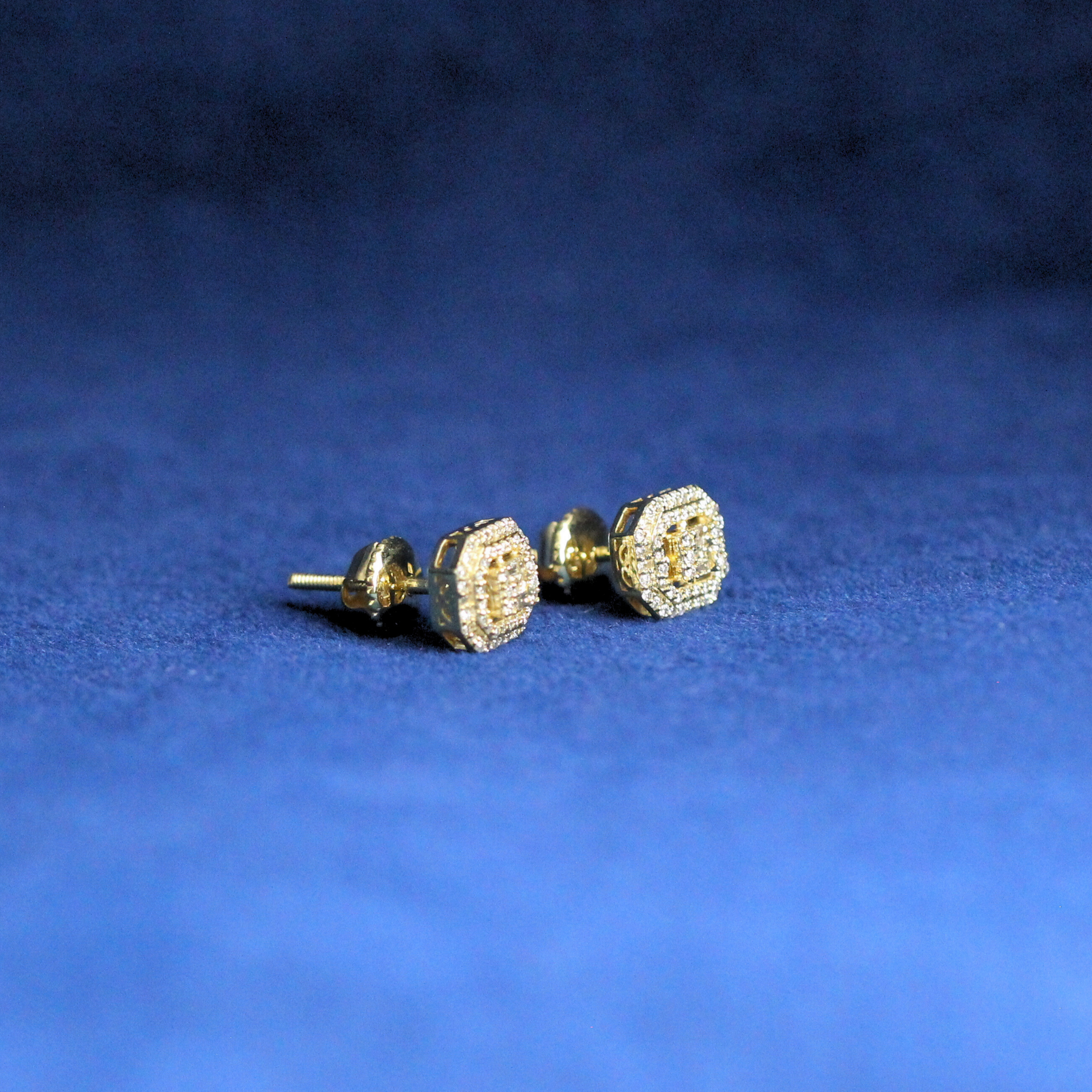 Right-side view of iced-out baguette luxe studs earrings in 925 silver with brilliant Moissanite diamonds, a must-have for hip-hop fashion.
