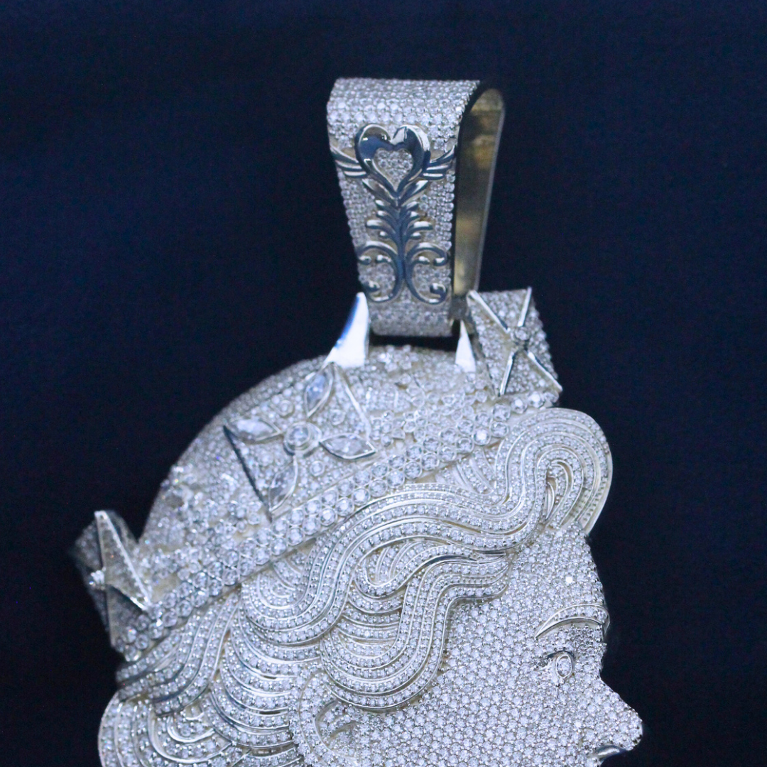 A close-up zoomed-in view of Diamond Dynasty Pendant in gold, showcasing the intricate Moissanite diamond details in a high-end hip-hop jewelry piece.