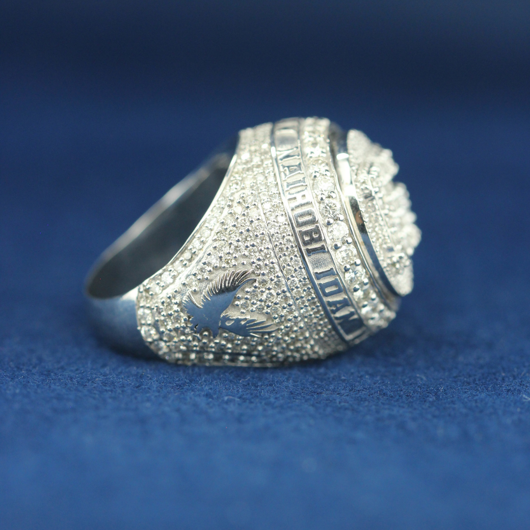 A left-side view of a hip-hop jewelry RC Championship ring in 925 sterling silver, designed with a bold and powerful aesthetic.