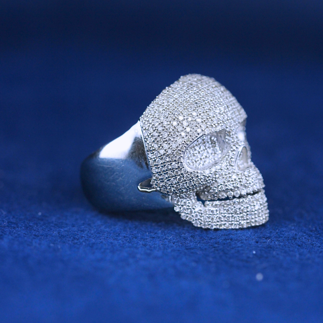 A left-side view of a hip-hop jewelry skull ring in 925 sterling silver, designed with edgy craftsmanship and bold aesthetics.