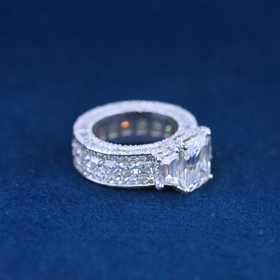 A left-side view of a hip-hop jewelry total iced-out ring in 925 sterling silver, showcasing the ultimate iced-out design for a bold hip-hop style.