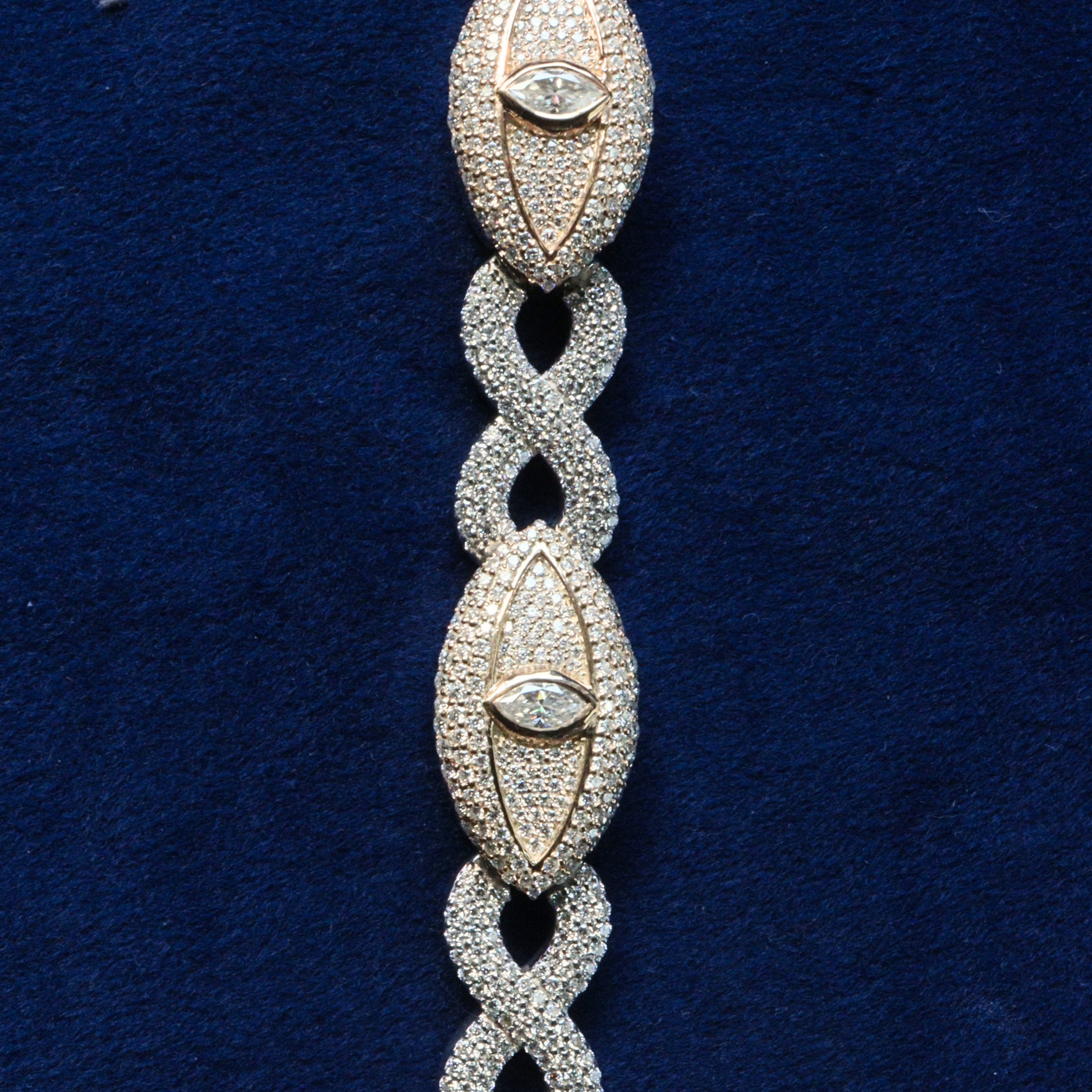 Close-up detail of Infinite Guardian Bracelet, highlighting moissanite brilliance and meticulous silverwork.