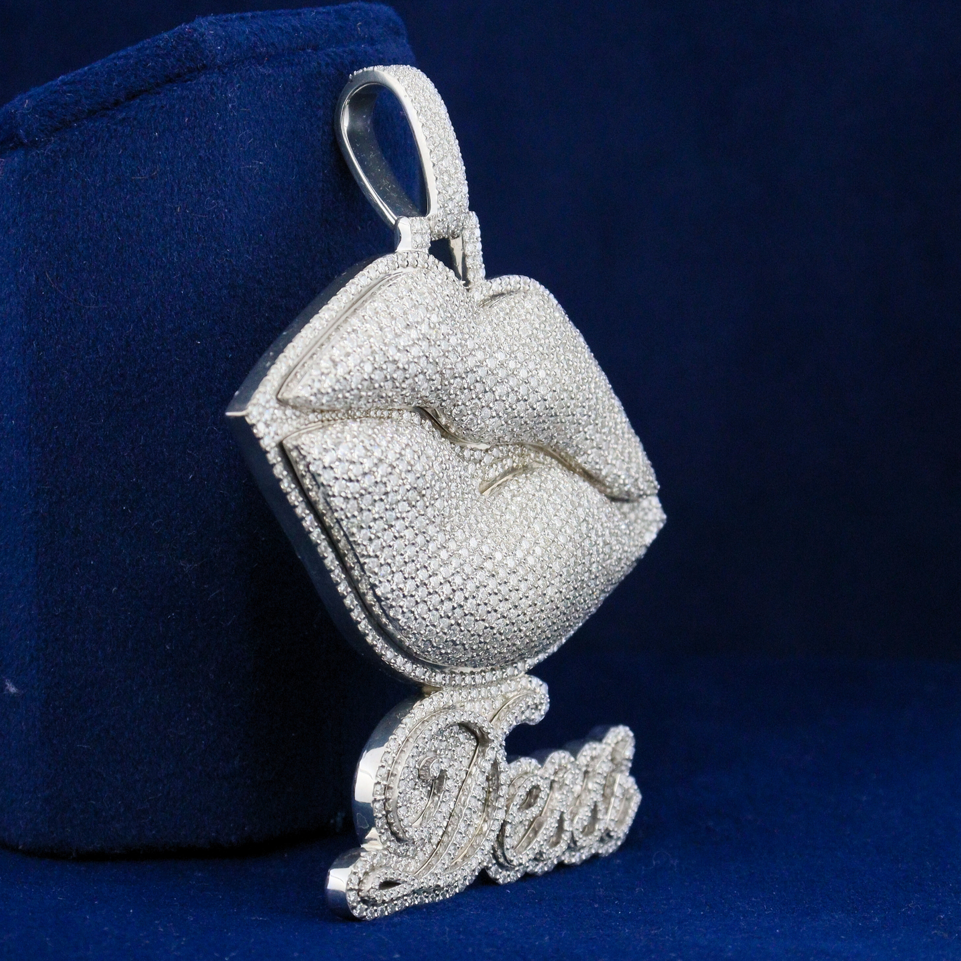 Right side view of the Luxe Lips Pendant showcasing its sleek silver profile and shimmering moissanite stones.