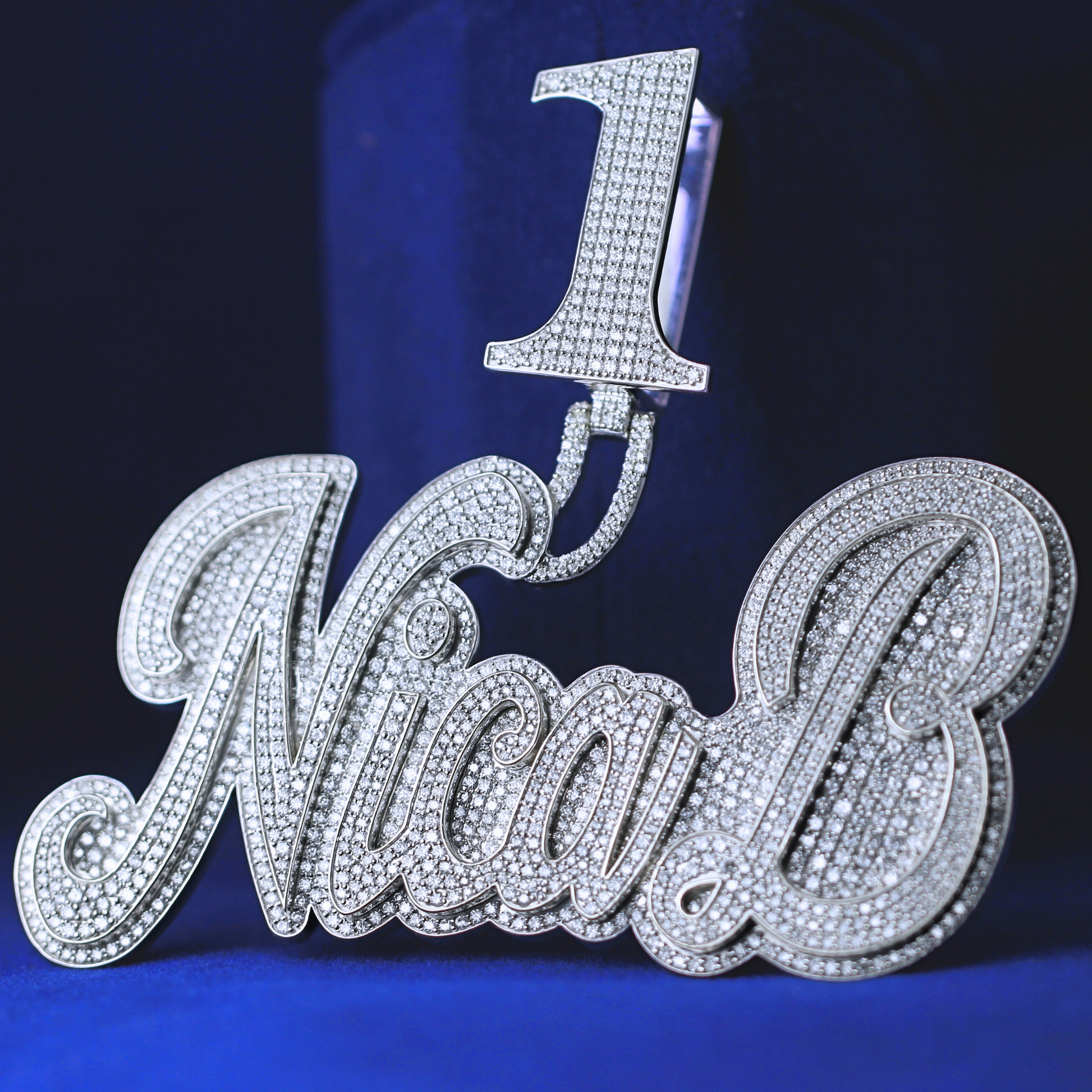 Right side angle of iced-out Number 1 Nica B Diamond Pendant, showcasing intricate moissanite diamond setting and bold design.