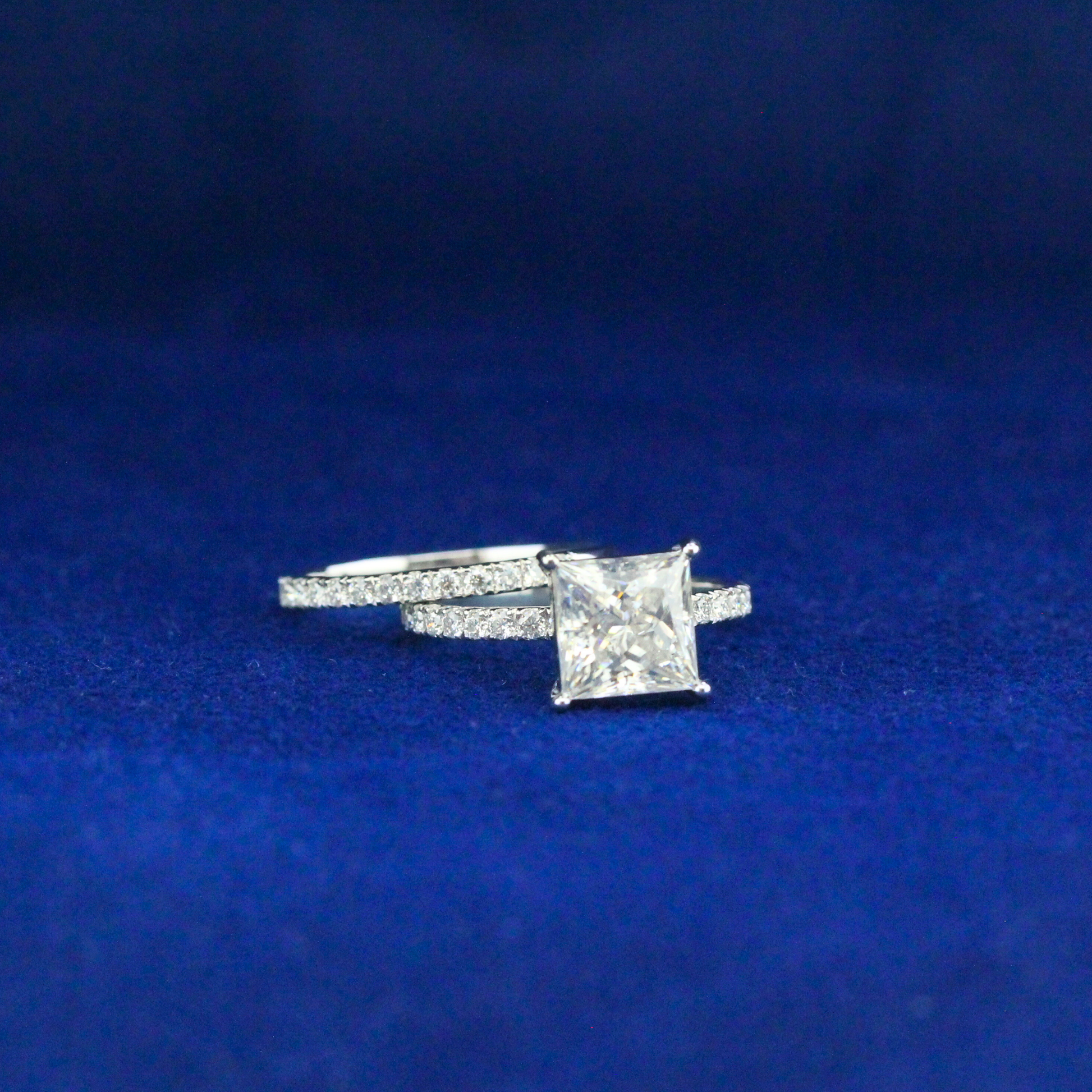 Front view of elegant princess ring with moissanite diamond in 925 sterling silver, timeless fine jewelry.