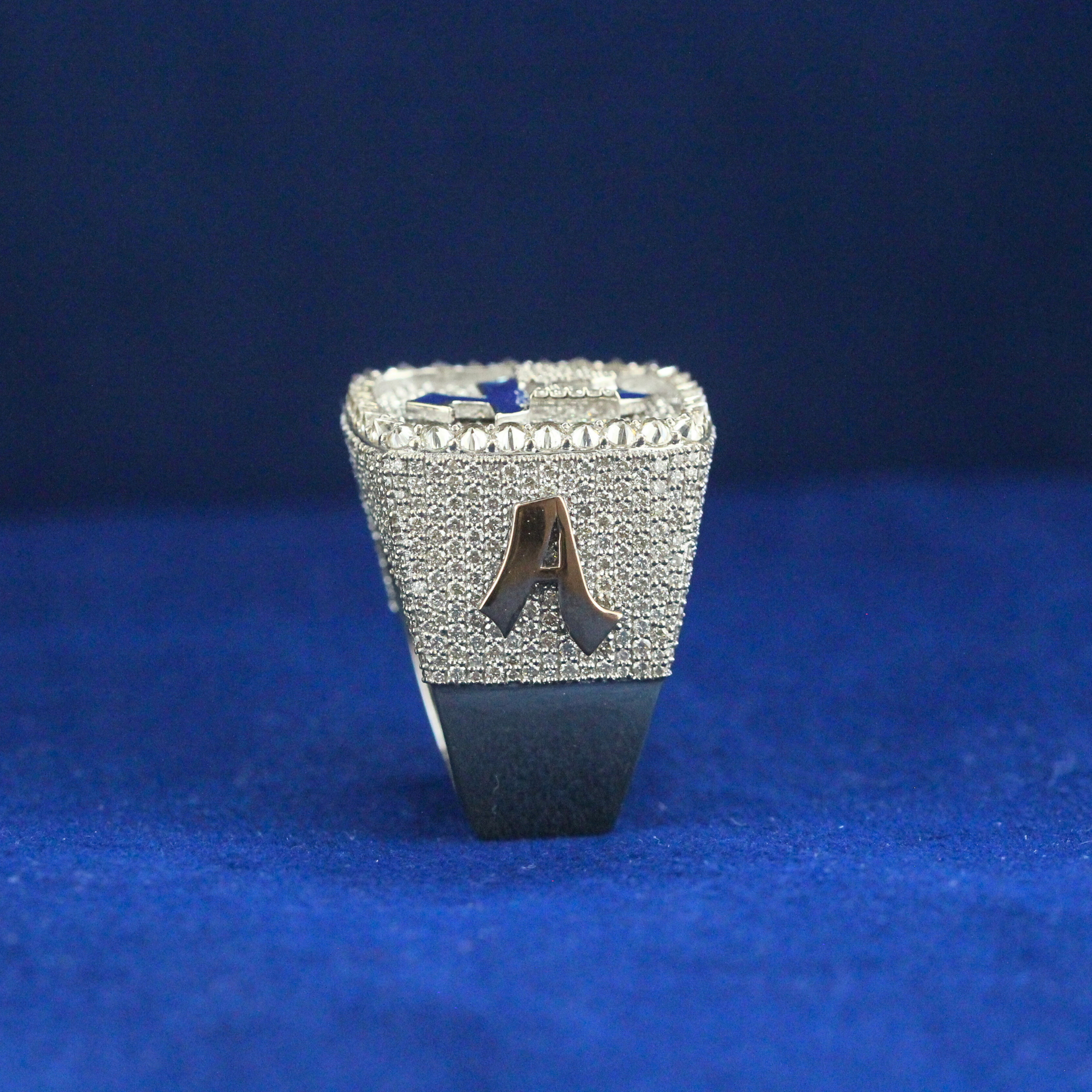 Standing view of the Victory Four Elite Ring, featuring a bold 925 silver band and radiant moissanite stones, showcasing luxury fine jewelry with hip hop flair.