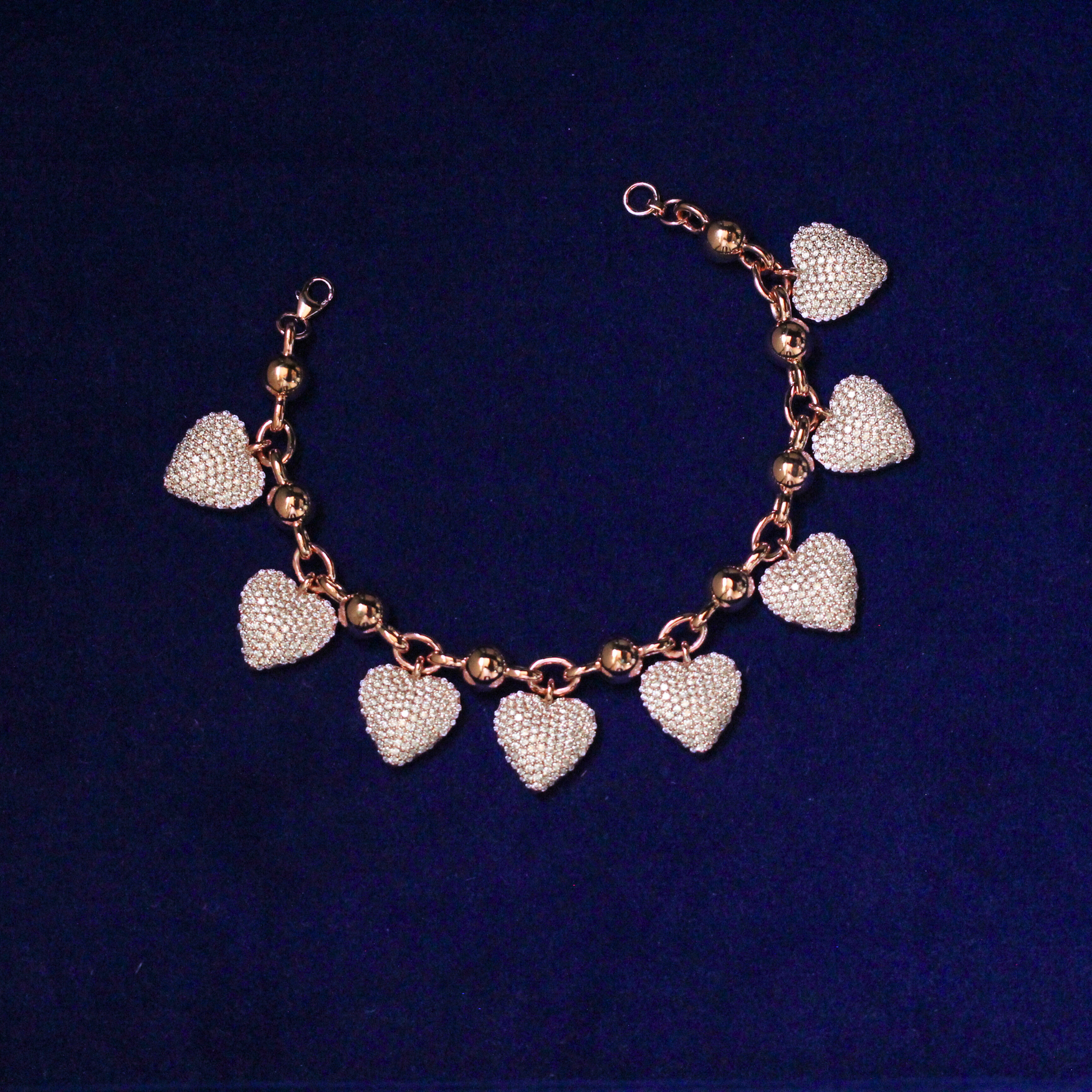 Front view of zirconia heart bracelet in 925 silver with sparkling moissanite stones, elegant fine jewelry design.