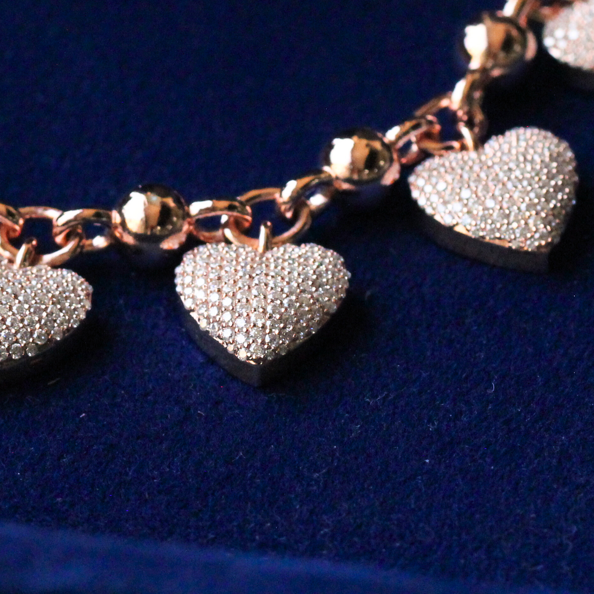 Side profile zoom view of the zirconia heart setting, showing moissanite sparkle and precise silver craftsmanship in fine jewelry.