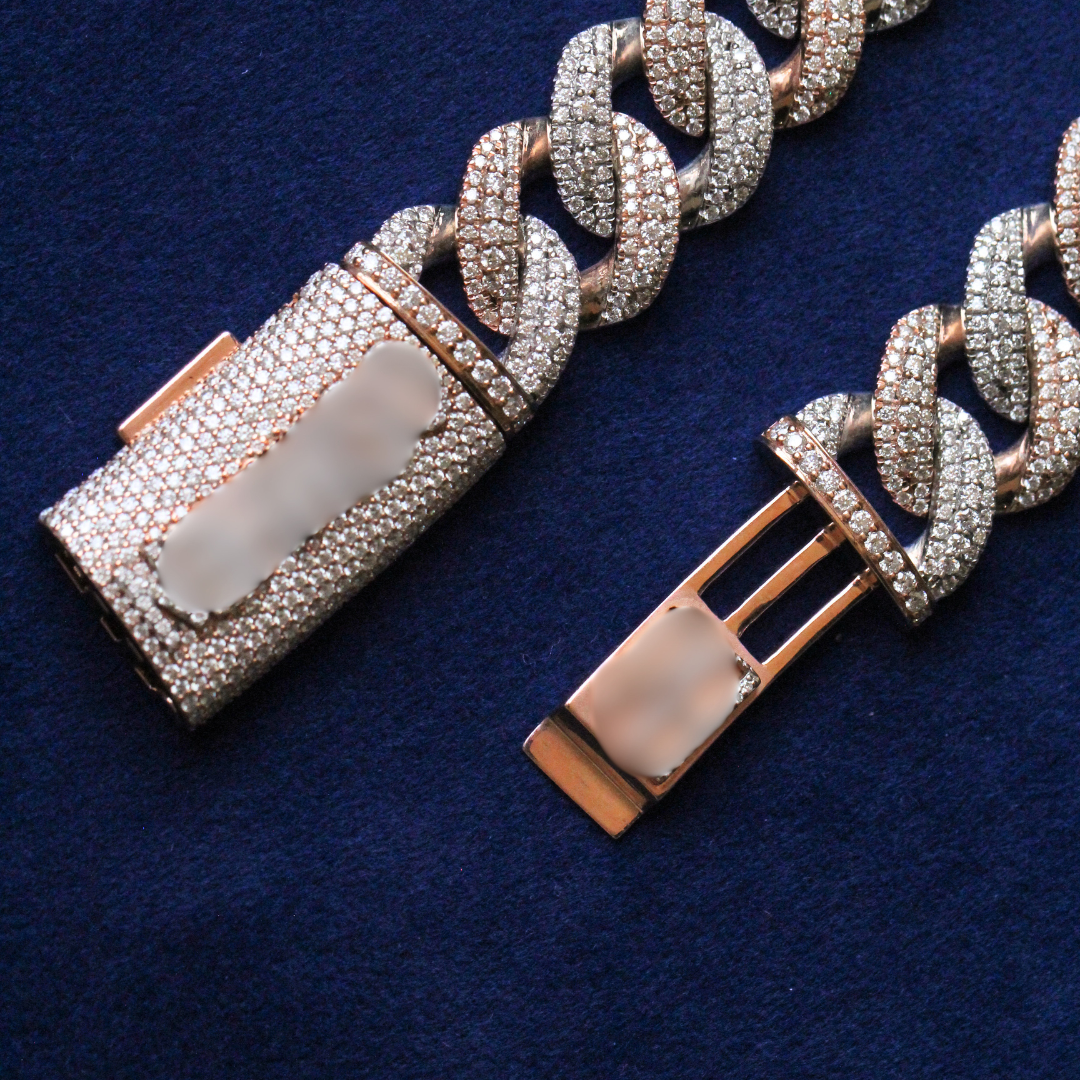 Zoomed-in view of the iced-out lock clasp on a Miami Cuban chain, crafted in 925 silver and moissanite diamonds, emphasizing secure fit and luxury detail in fine hip hop jewelry.