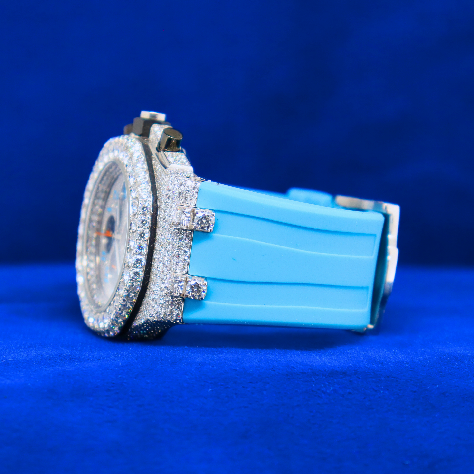 Left view of Blue Iced Frost Phantom – half iced custom watch in 14K white gold with moissanite diamonds and bold icy blue finish