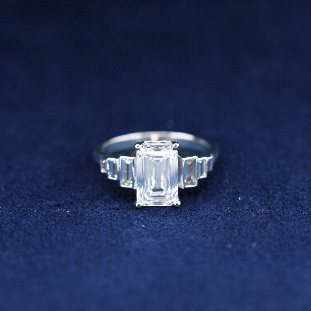 Elegant emerald diamond and moissanite ring in 925 silver, front view showcasing fine jewelry craftsmanship.