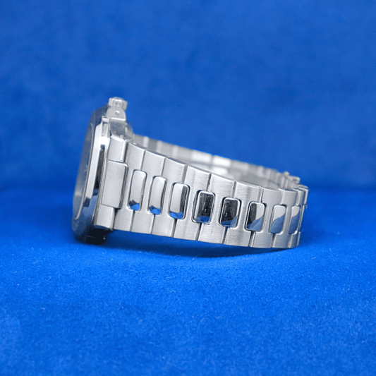 Left-side view of Nautilus Master Chrono plain stainless steel watch, built for durability and style.