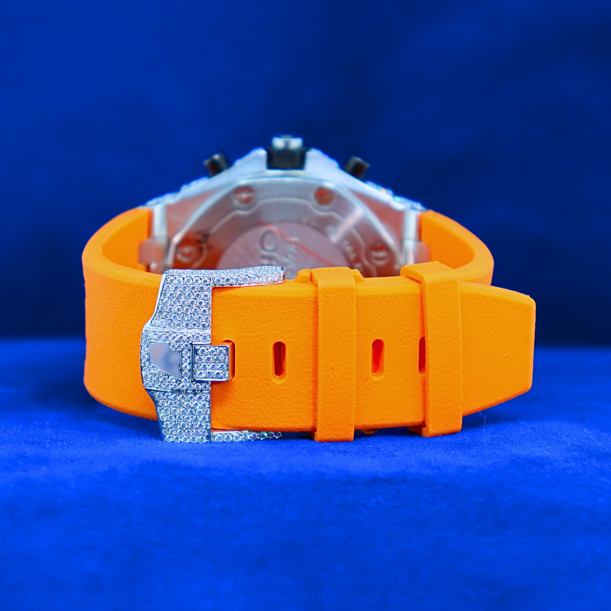 Back view of Orange Iced Blaze Phantom – iced out watch back in moissanite diamonds, crafted in 14K white gold with orange strap energy