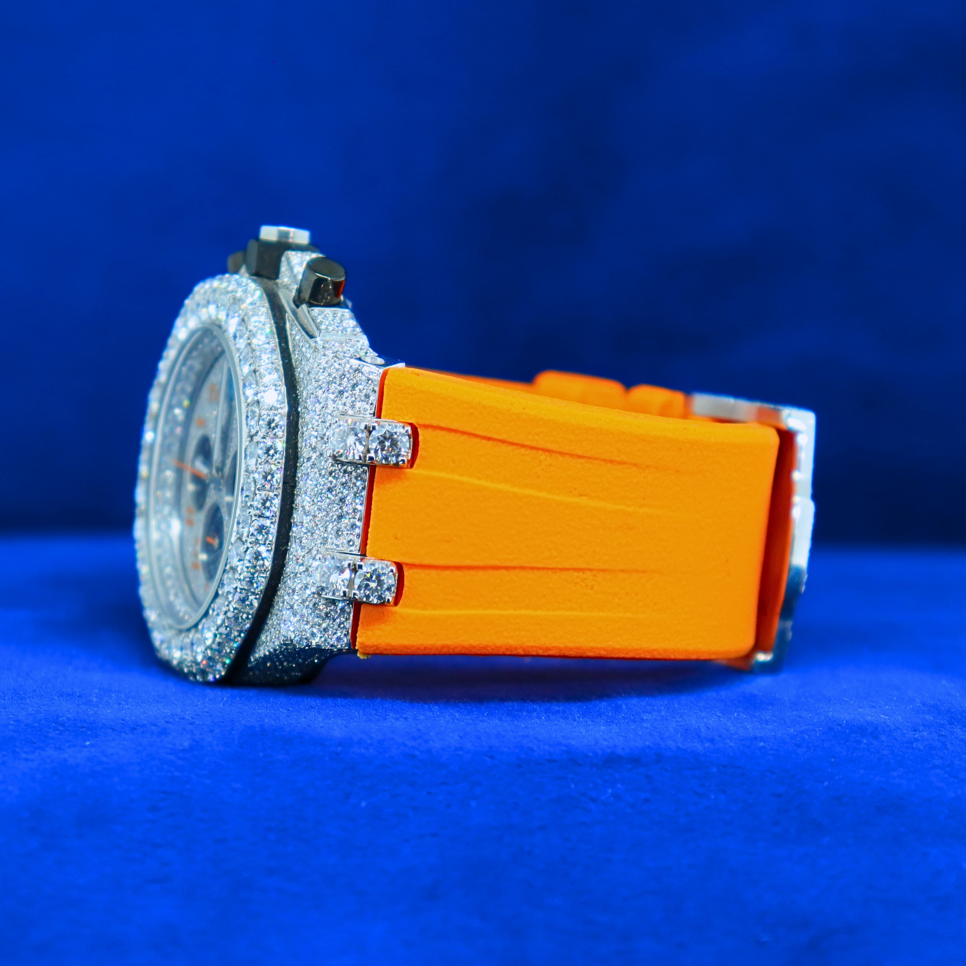 Left view of Orange Iced Blaze Phantom – 14K white gold custom timepiece with moissanite bling and half iced out design for hip hop vibes