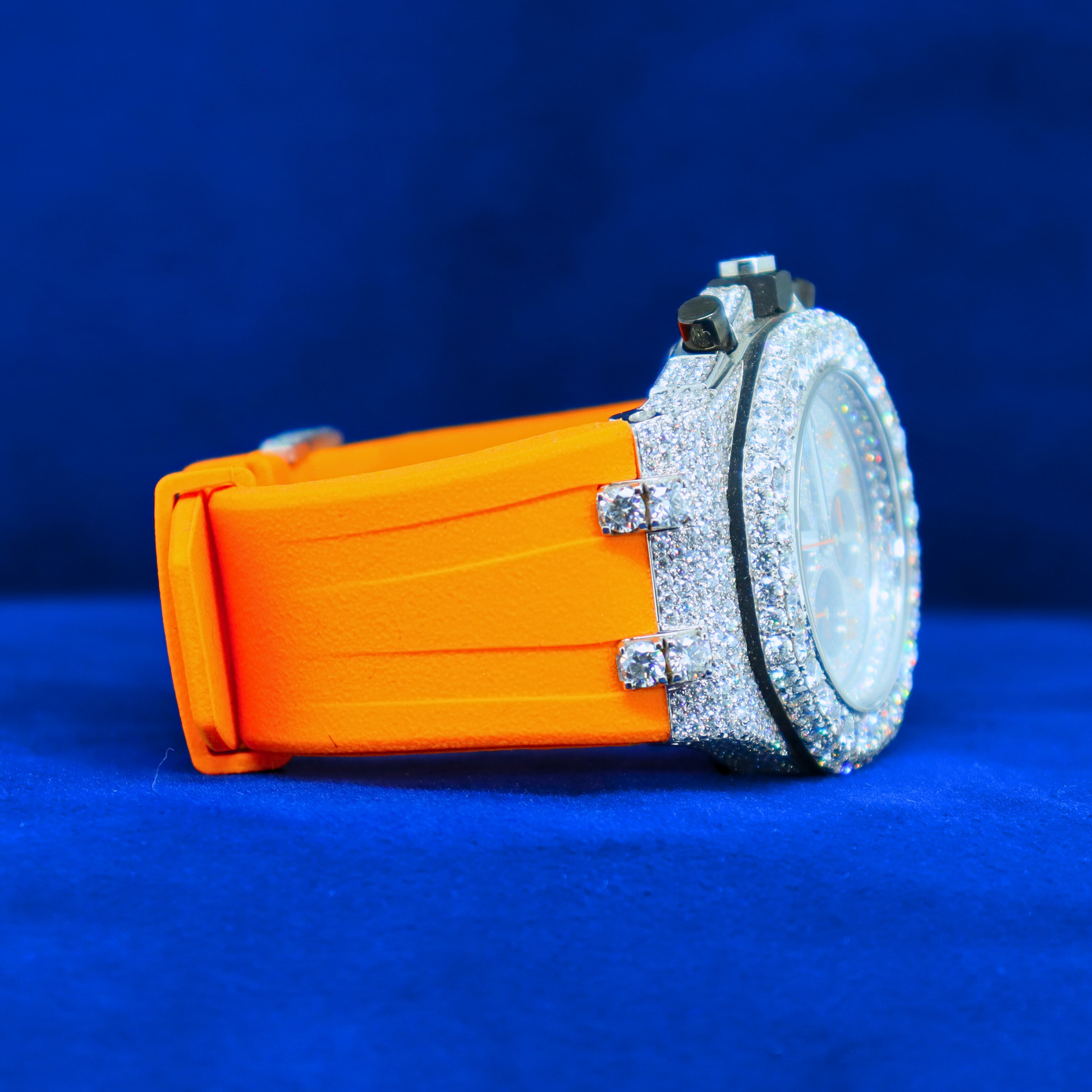 Right side angle of Orange Iced Blaze Phantom – fully dripped in moissanite diamonds, 14K white gold half iced out custom watch with orange heat
