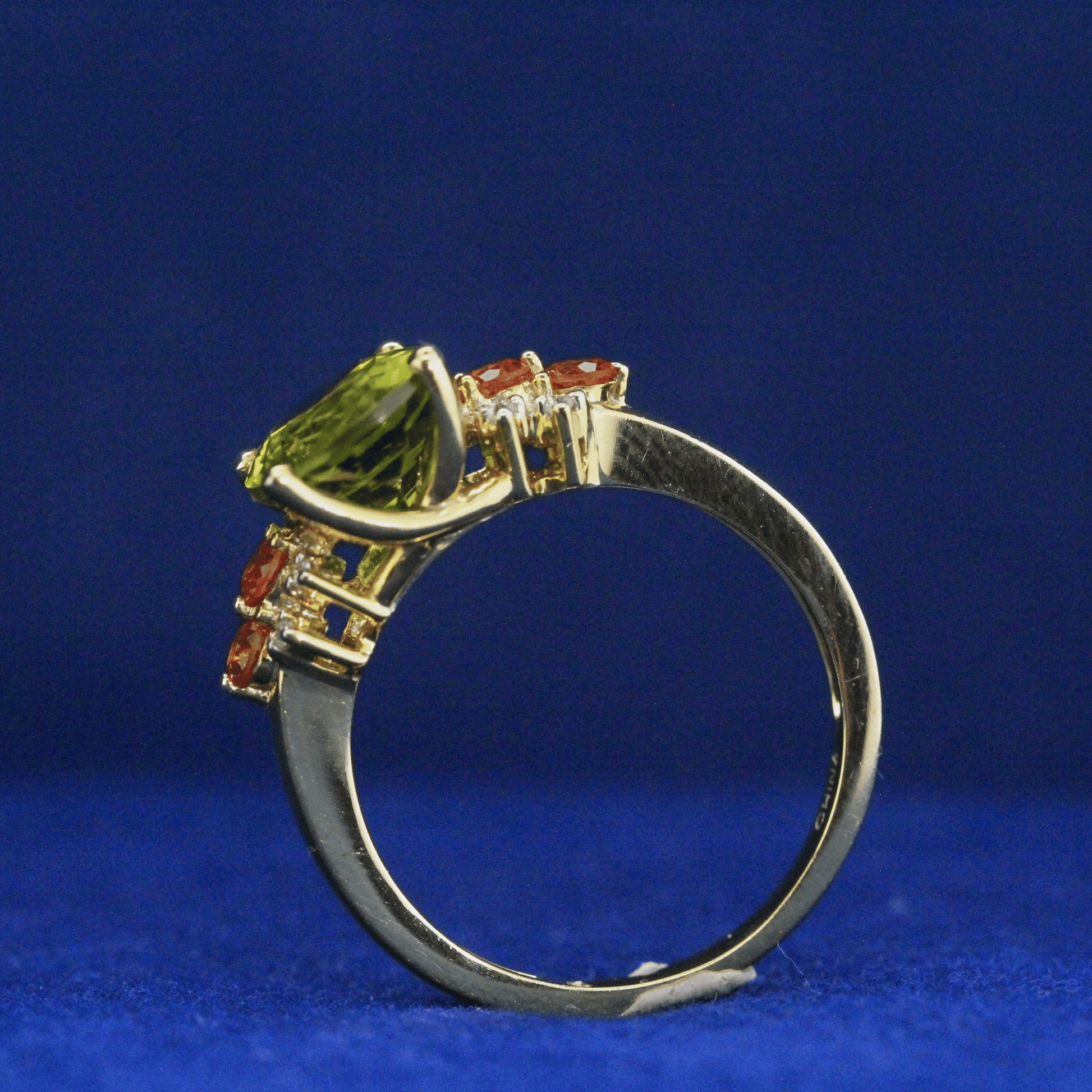 Left top side view of Peridot Cocktail Ring with vibrant green gemstone – Fine jewelry