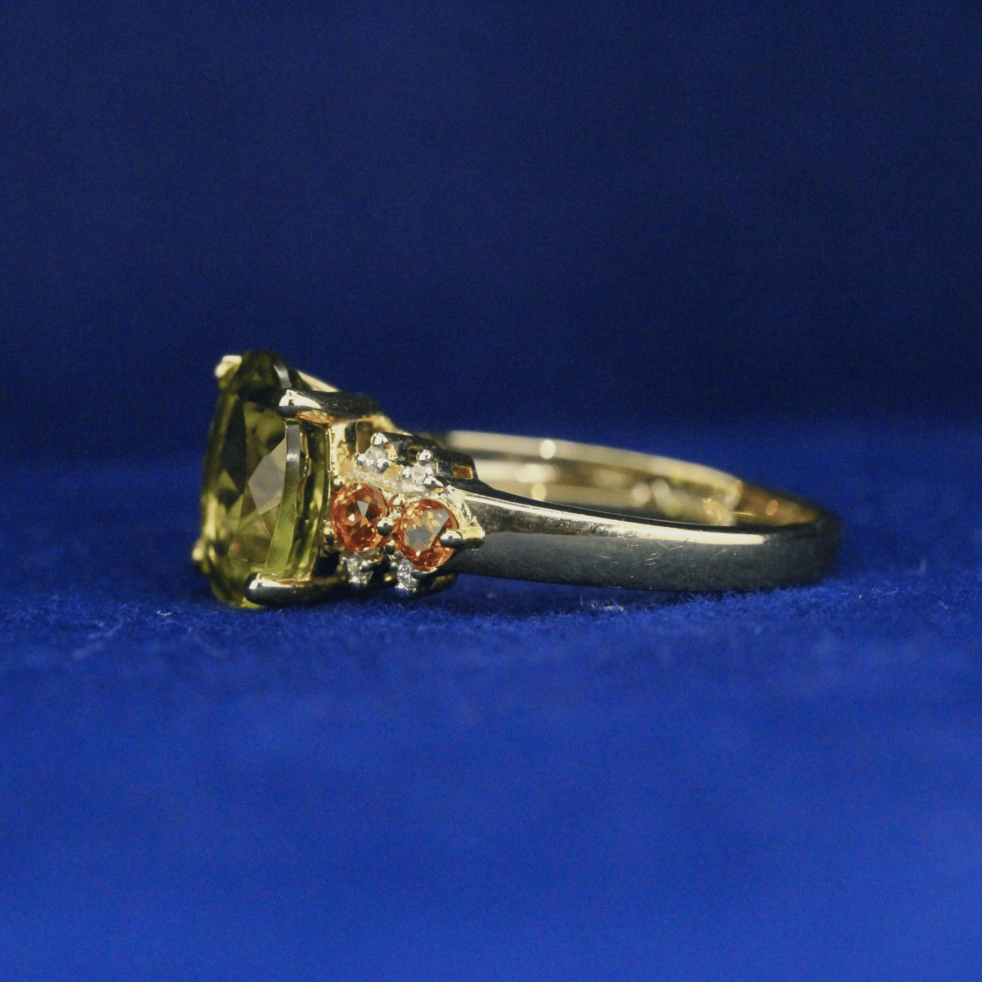 Left side view of Peridot Cocktail Ring with vibrant green gemstone – Fine jewelry
