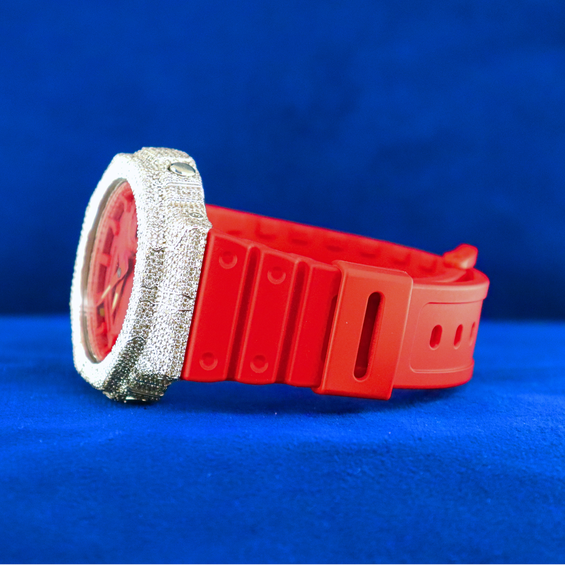 Left side view of Red Iced Phantom – half iced out red digital watch dripping in moissanite diamonds and 14K white gold casing