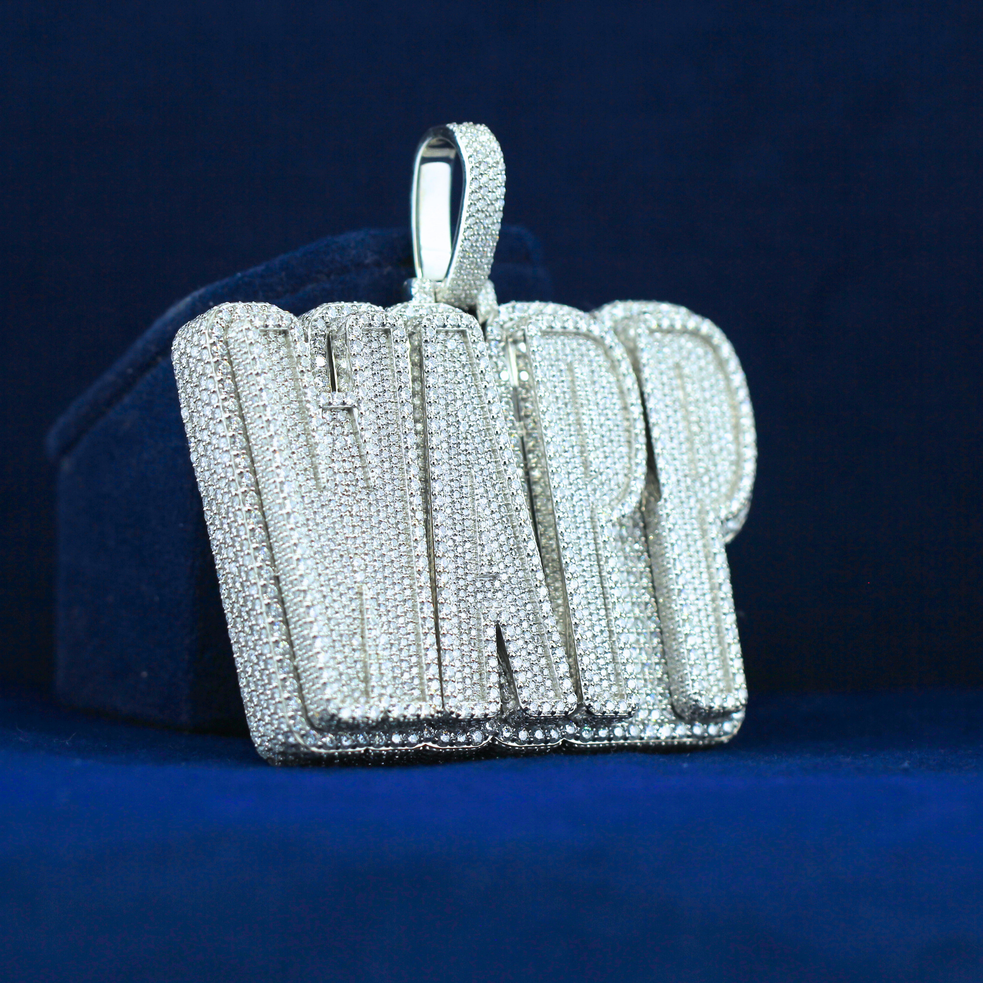 Right angle of WAPP iced out letter pendant with custom moissanite diamonds in white gold – luxury hip hop drip