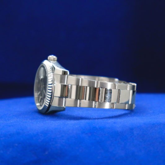 Left side view of half iced out custom sleek gunmetal grey dial watch with polished edges and bold style