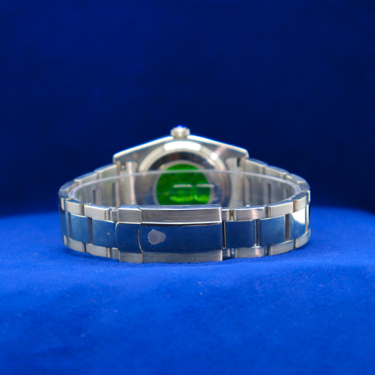 Back view of sunburst blue dial half iced out custom watch showing durable stainless steel craftsmanship