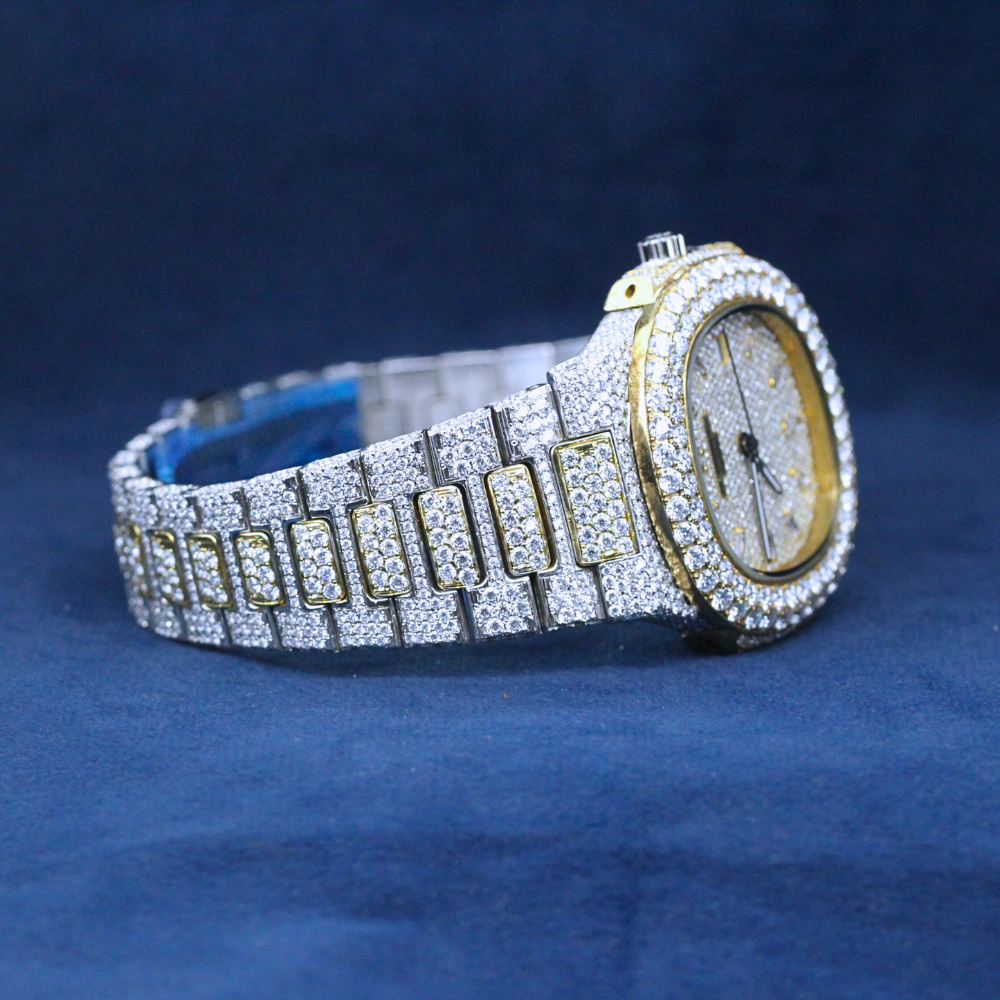 A right-side view of a custom iced-out hip-hop watch featuring a two-tone design with an iced-out bezel and Moissanite diamond-studded band.