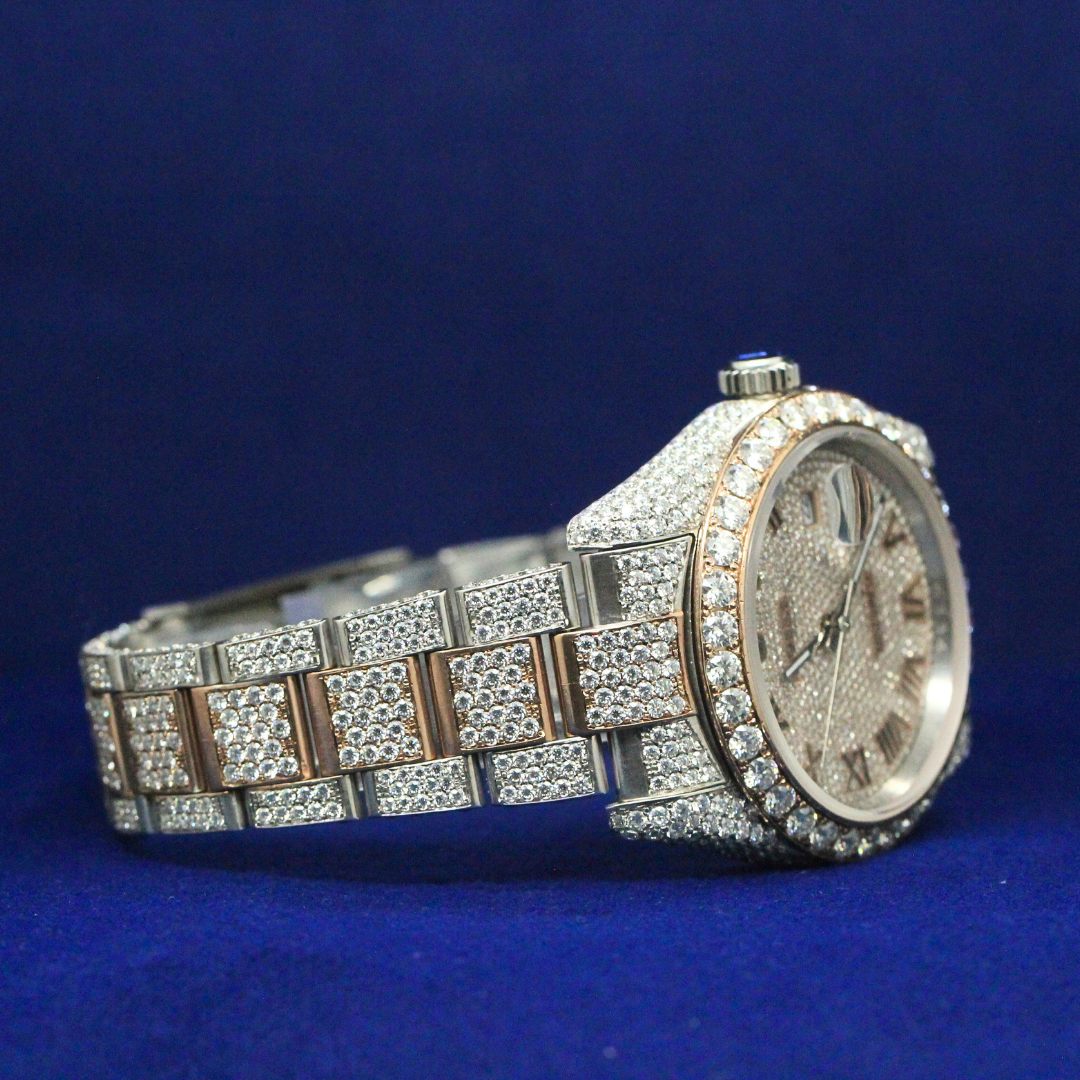 Right side profile of Golden Roman Majesty watch showing iced bezel, gold tone case, and diamond detailing.