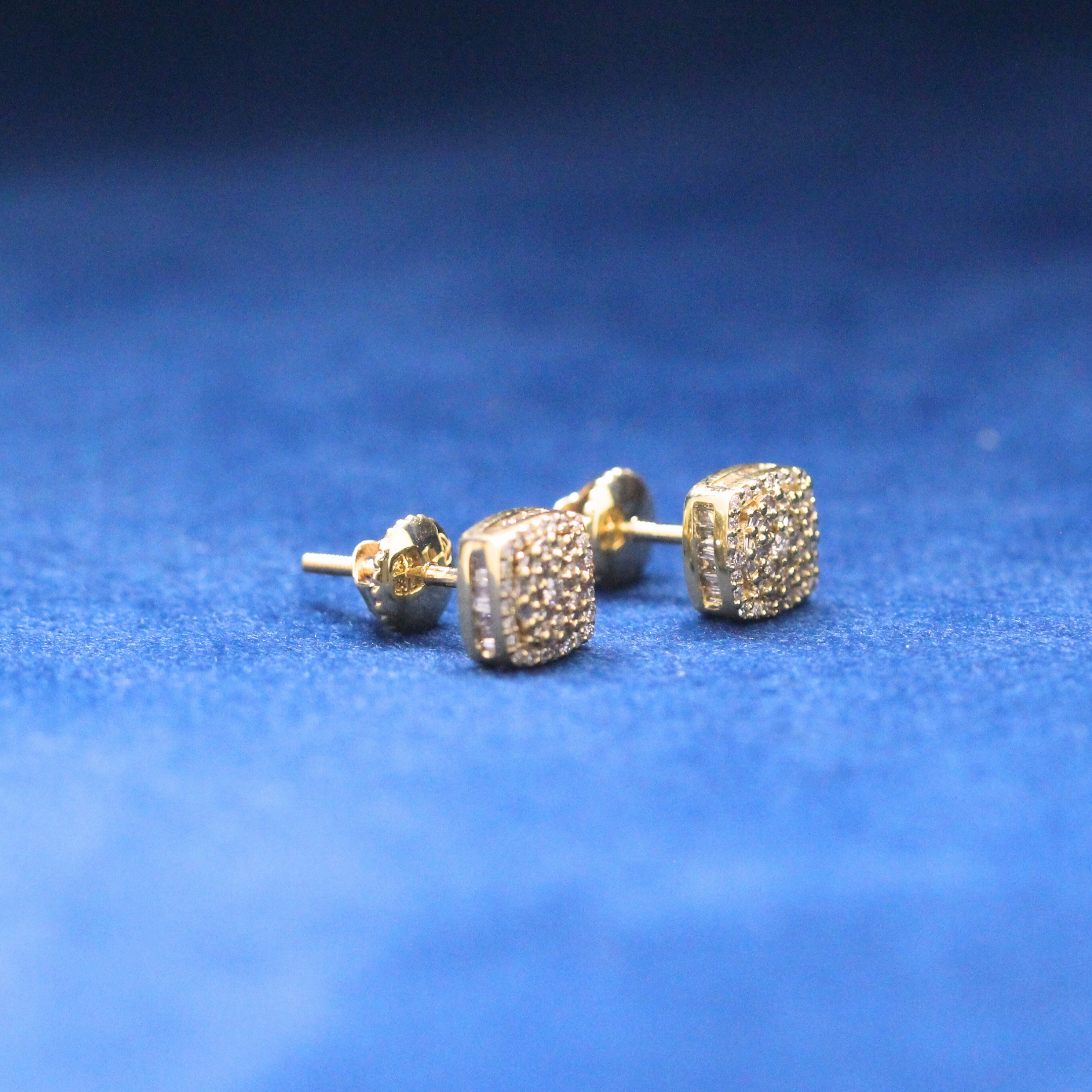 Left-side view of Golden Frost Studs earrings in 925 silver, showcasing a flawless iced-out design with Moissanite diamonds for hip-hop fashion lovers.