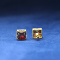 Right-side view of Ruby Cube Studs earrings in 925 silver, showcasing a striking ruby centerpiece surrounded by sparkling Moissanite diamonds.
