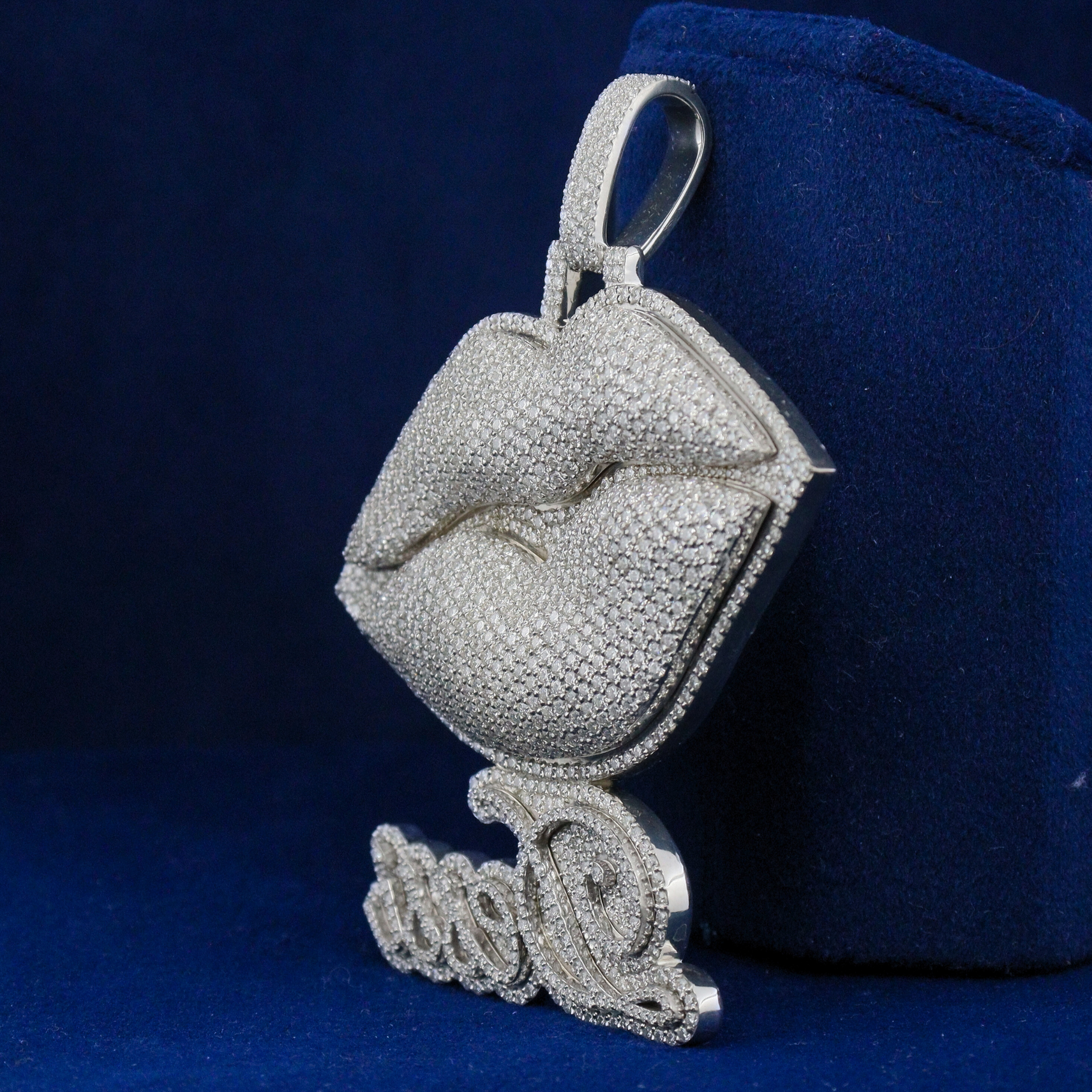 Left side view of the Luxe Lips Pendant revealing detailed contours and luxurious sparkle in fine jewelry design.

