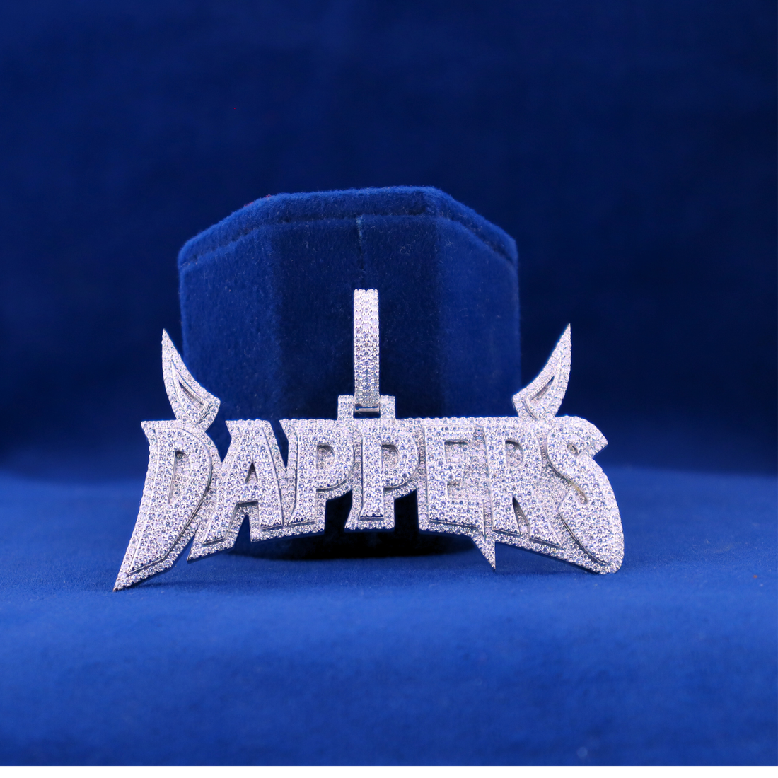 Front view of Dappers iced-out custom pendant in 14K silver with moissanite diamonds, matching half iced out custom watch