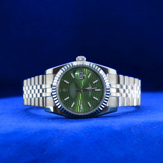 Front view of luxury green dial half iced out custom watch with elegant stainless steel design and diamond detailing

