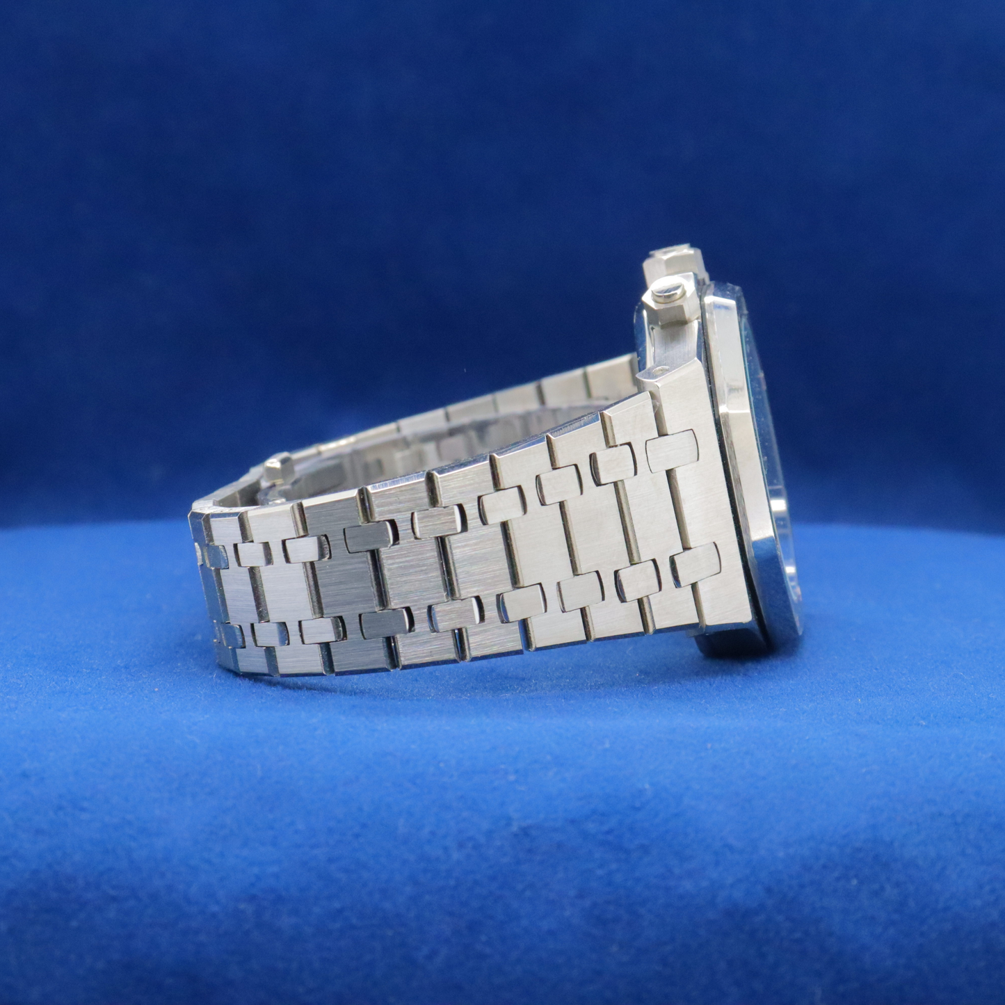 Right-side view of Royal Ice Blue Precision stainless steel watch, featuring a sleek and timeless look.



