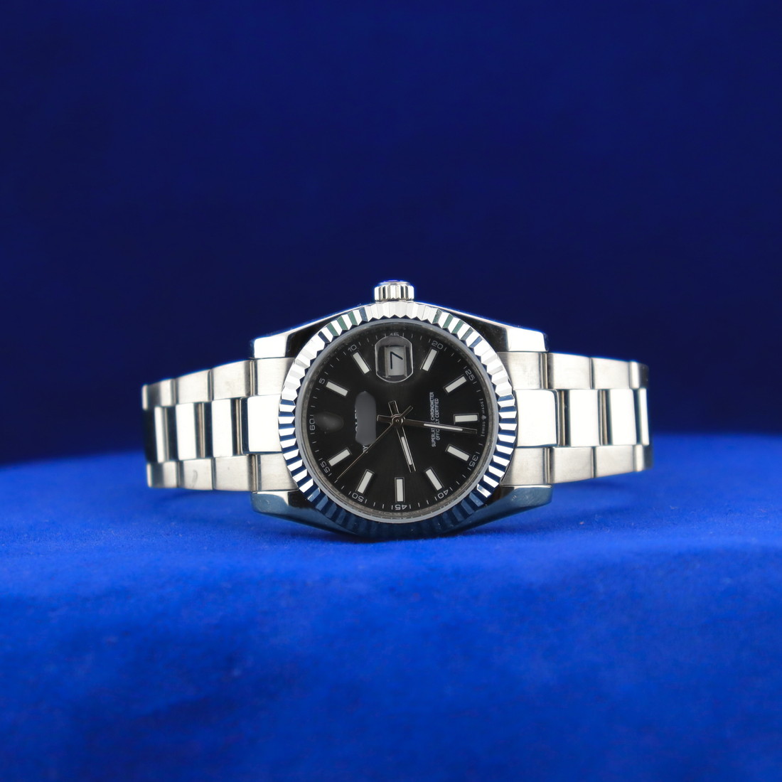 Front view of sleek black dial half iced out custom watch with luxury stainless steel design

