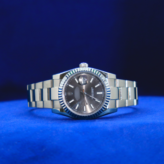 Front view of sleek gunmetal grey dial half iced out custom watch with minimalist luxury design

