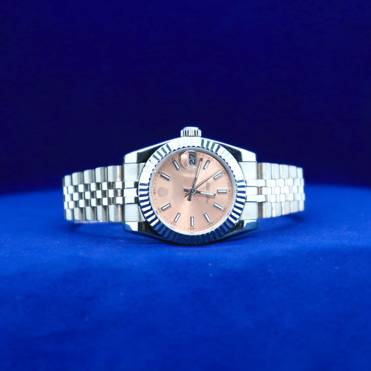 Front view of sleek light-pink dial half iced out custom watch with elegant feminine design and silver detailing

