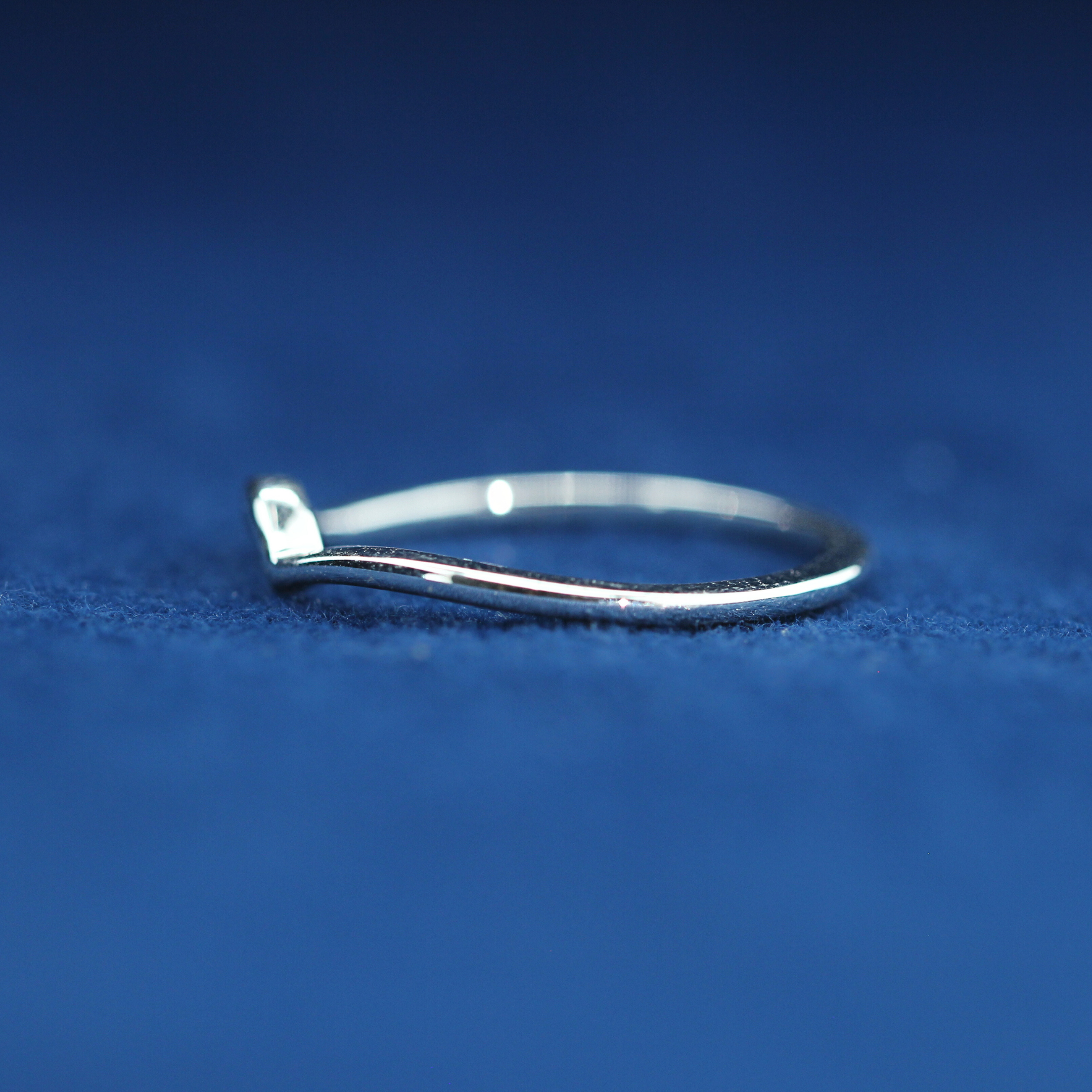Left view of 14K silver routine wear ring featuring moissanite stones – perfect match with custom iced out watches.
